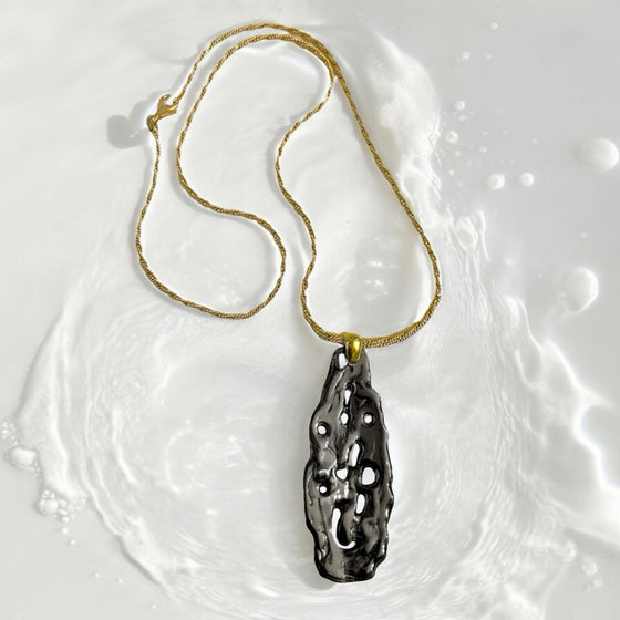 FLUID DROP SILVER PENDANT